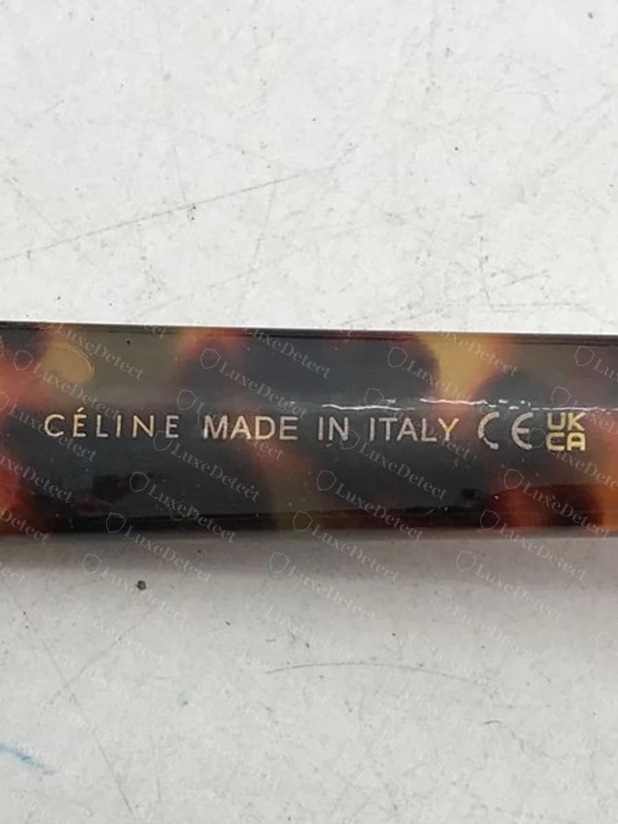 Counterfeit Triomphe temple: accented CÉLINE with no PARIS and no date code, next to CE and UKCA marks.