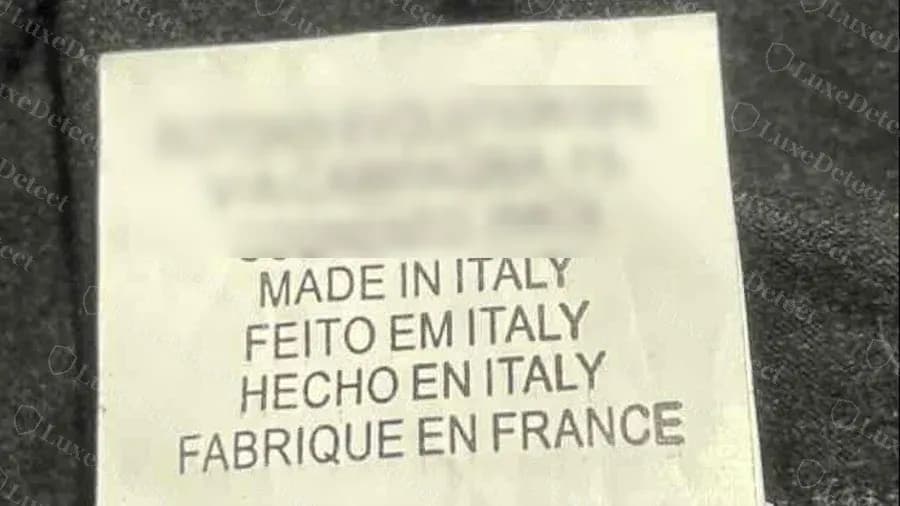 Fake label with a factory address and Made in Italy, Feito em Italy, Hecho en Italy and Fabrique en France lines