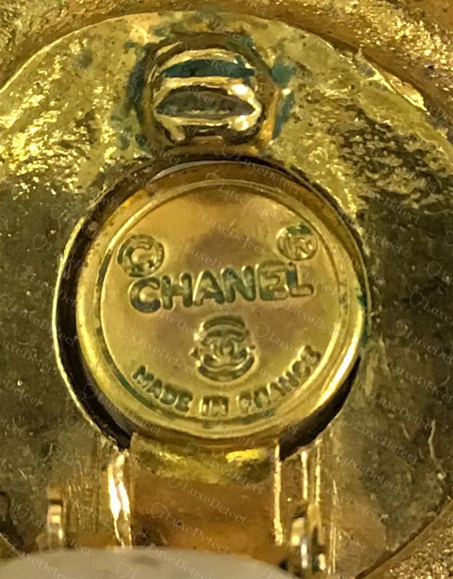 Genuine vintage Chanel pearl clip-on earring, a round undated plaque reading "©CHANEL®" with the CC logo and "MADE IN FRANCE" beneath