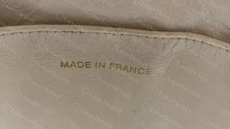 Genuine older white GST with MADE IN FRANCE stamped in gold foil directly onto the leather lining
