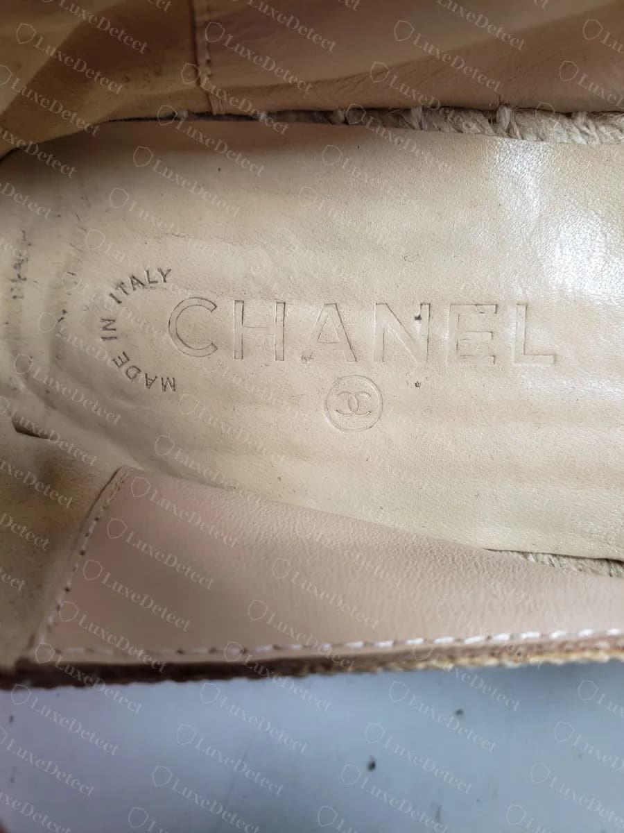 Counterfeit Chanel espadrille insole stamped MADE IN ITALY around the CHANEL wordmark