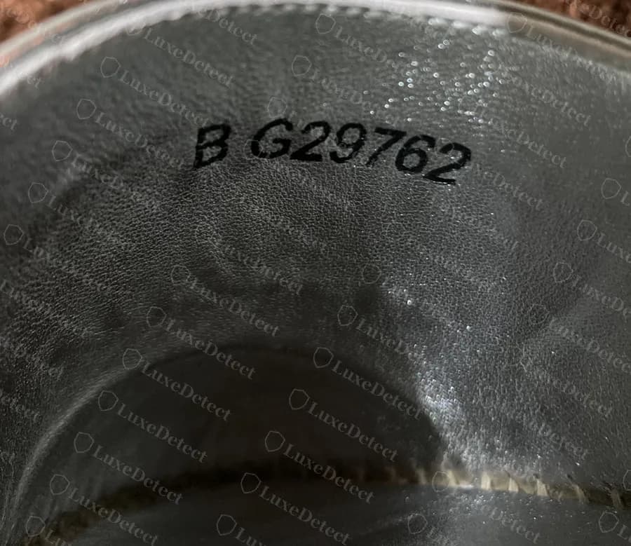 Counterfeit Chanel espadrille lining reading B G29762 with no size, a correctly formatted code on a fake pair