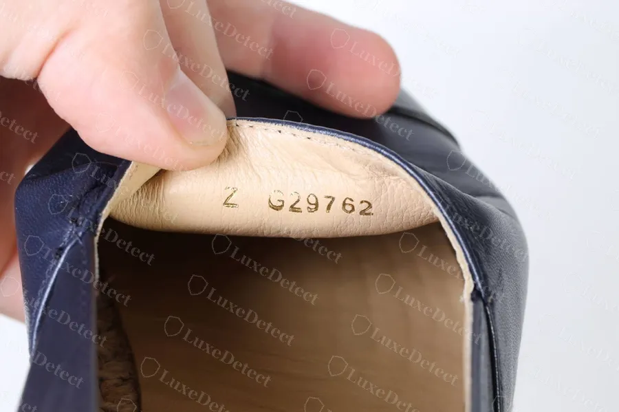 Authentic Chanel espadrille lining code reading Z G29762 in gold, with nothing printed after the reference
