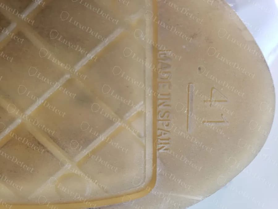 The sole of the same counterfeit pair reading MADE IN SPAIN under size 41, which contradicts its insole