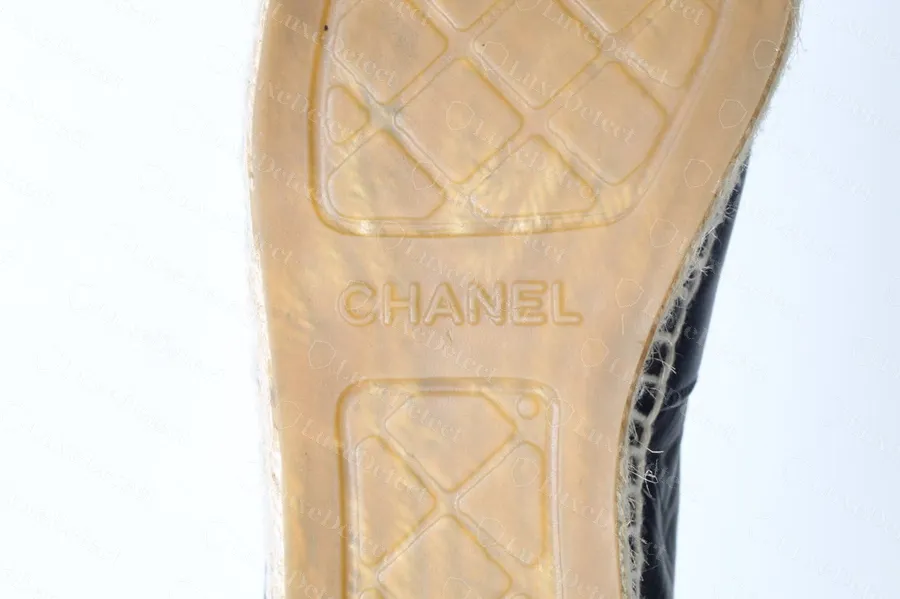 Worn authentic Chanel espadrille sole with translucent amber tread panels and the jute visible through the rubber