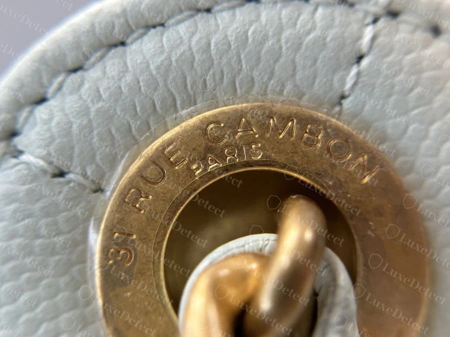 Genuine chain-connector ring stamped "31 RUE CAMBON PARIS," evenly engraved around the ring's curve