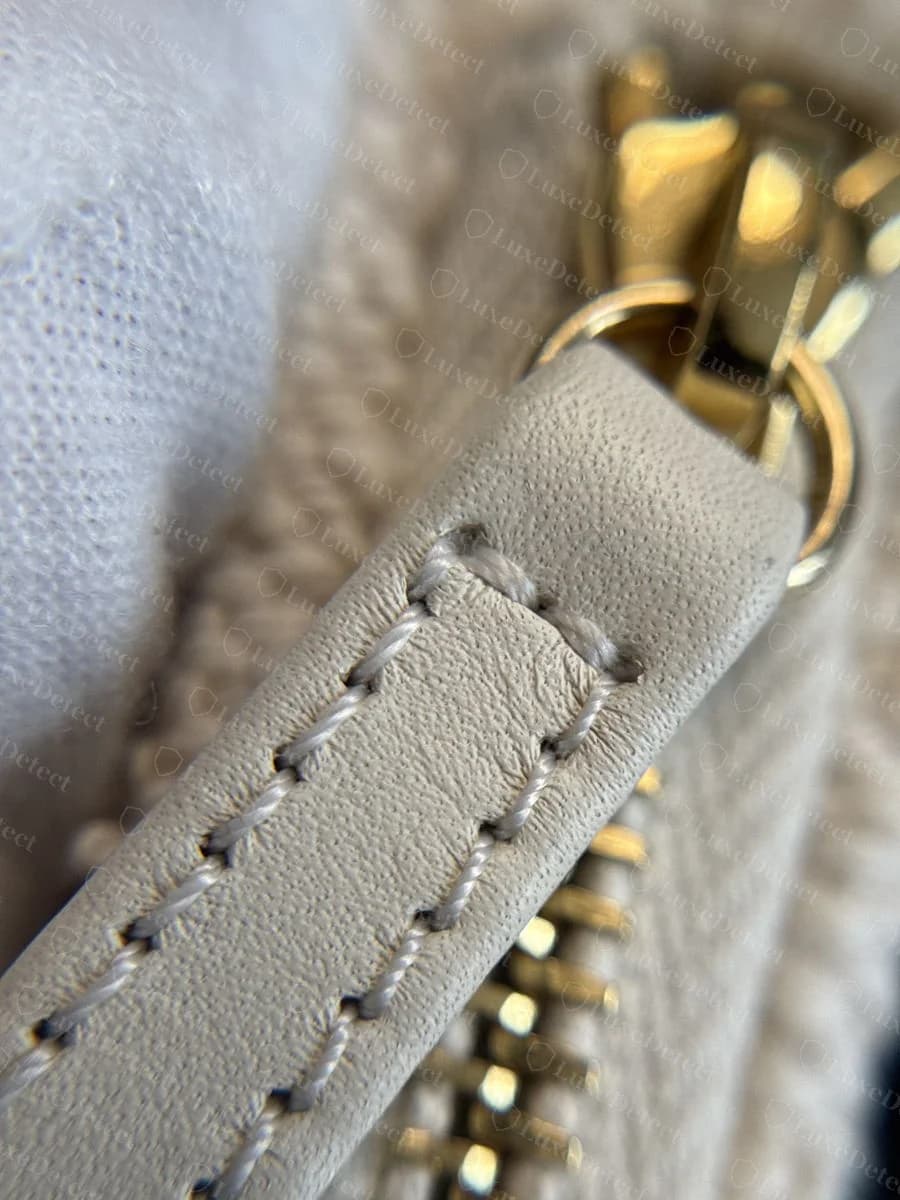 Genuine Chanel Deauville interior tag — crisp foil-stamped "CHANEL MADE IN ITALY" lettering with clean, distinct edges