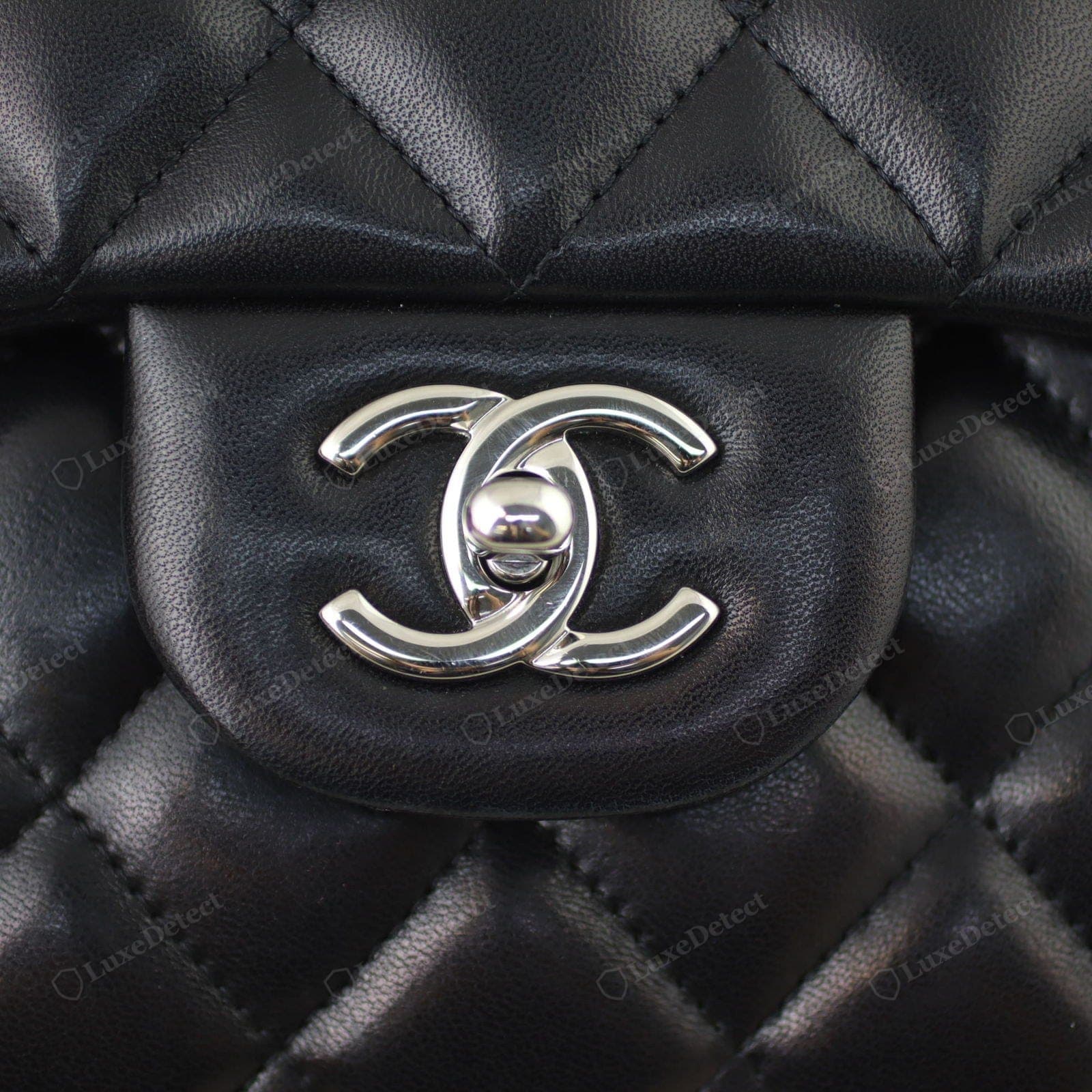 Genuine Chanel CC turn-lock — the right C over the left at the top, over the left at the bottom, even plating, precise rotation