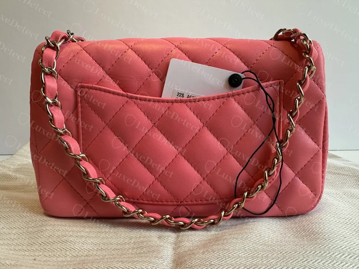Genuine Mini Flap back: a flat quilted slip pocket on the rear, with the chain running down each side