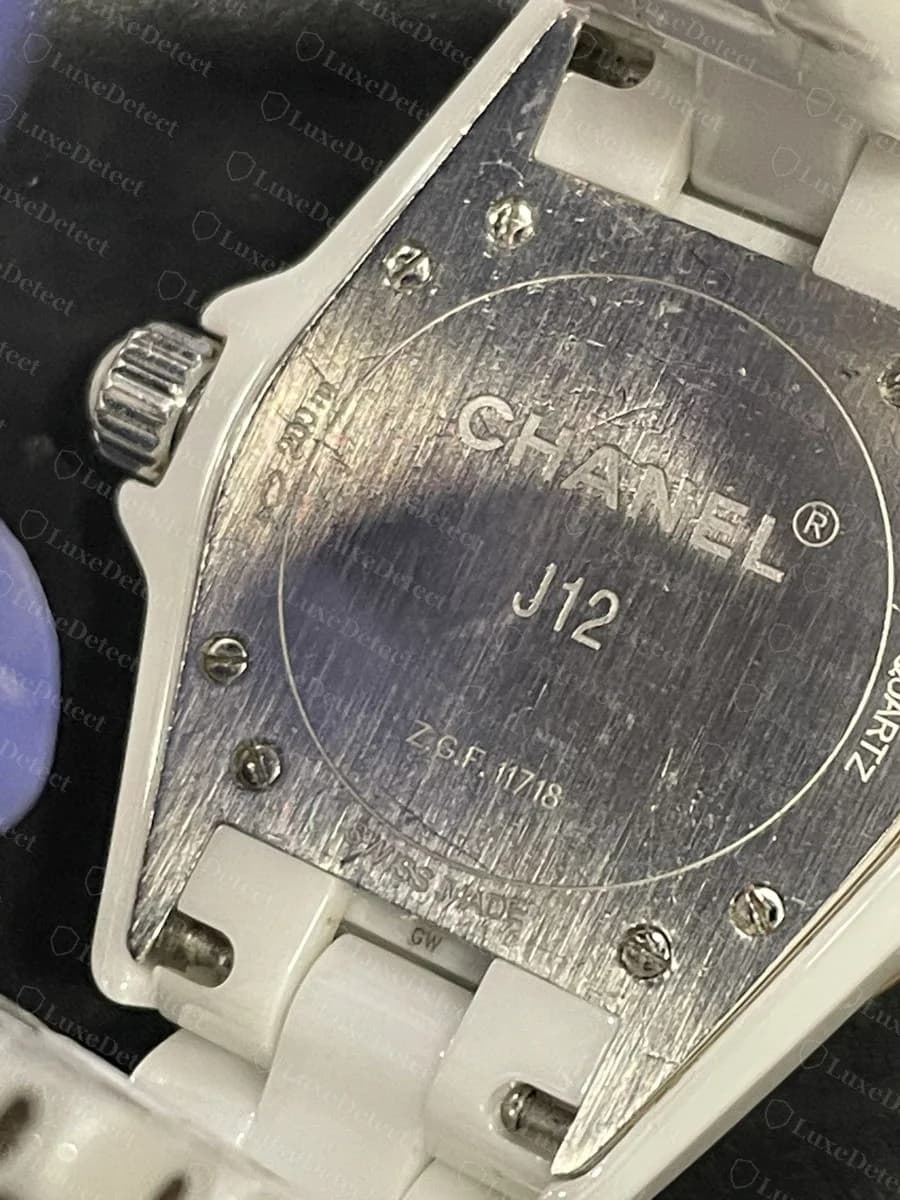 Authentic J12 caseback: "CHANEL / J12 / Z.G.F.11718 / QUARTZ / SWISS MADE," the clean reference-code format every genuine caseback in our sample followed.