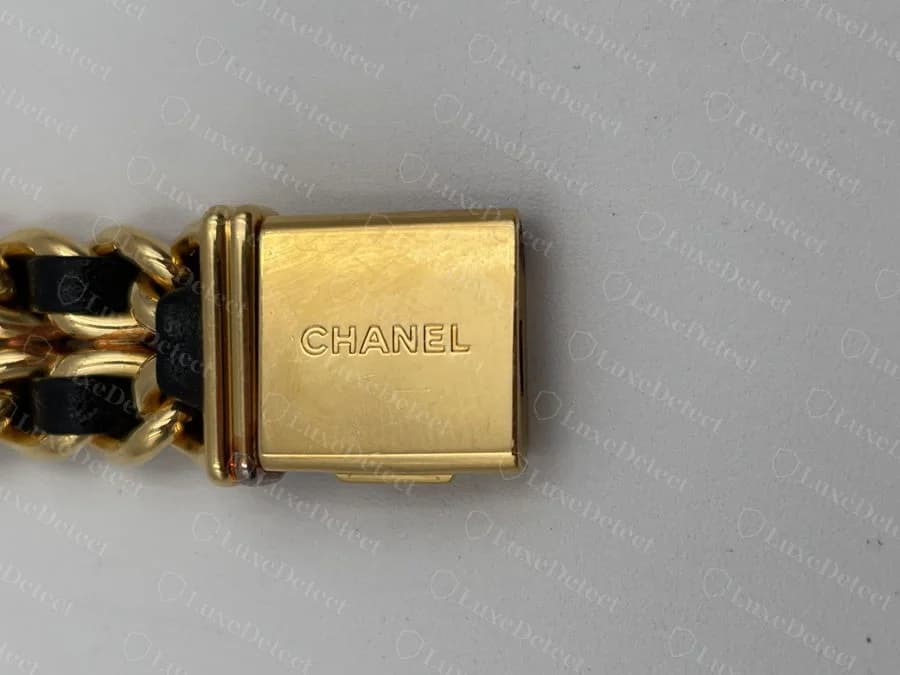 The clasp on that same authentic Première: gold housing engraved "CHANEL," matching the front's hardware finish.