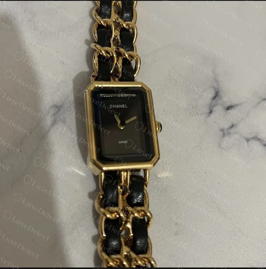 A Première-line fake: the octagonal case shape and gold-and-leather bracelet are convincingly copied.