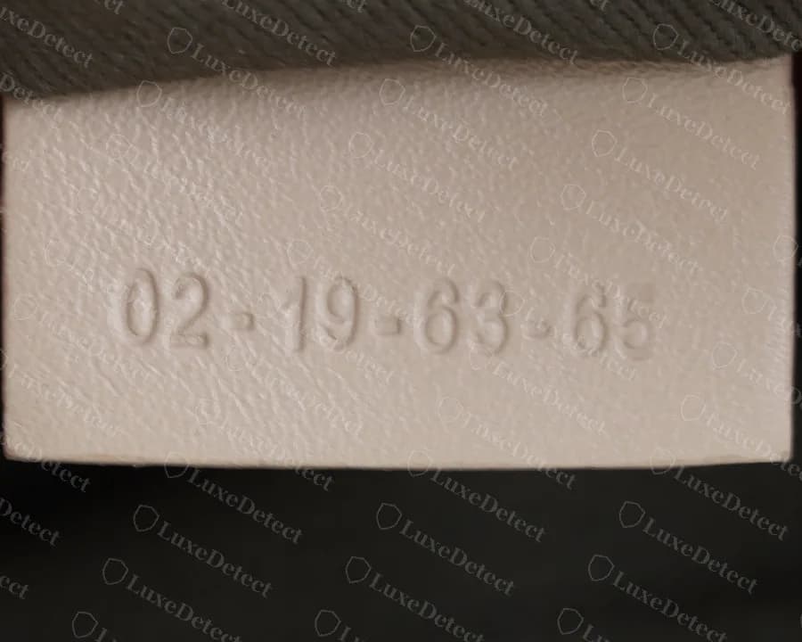 Genuine Chloé Marcie serial tag from a newer satchel: four hyphenated pairs of digits heat-stamped on a leather tab