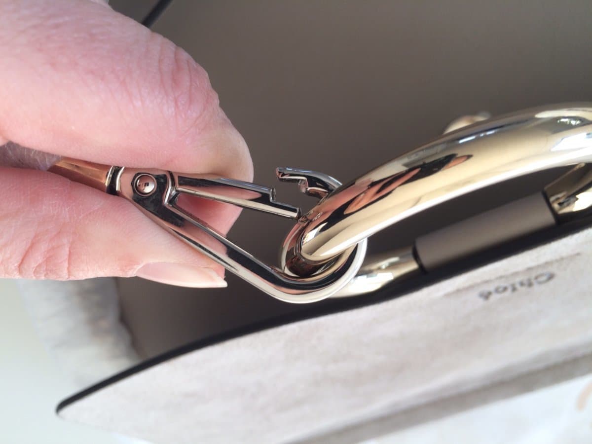 Authentic Chloé hardware: silver carabiner and gold-toned ring — correct for the Faye model