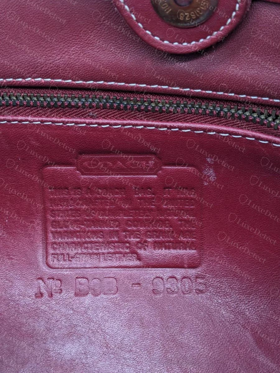 The creed patch of a bag our verdict logs list as counterfeit, with a lettered code B0B-9305 that decodes cleanly as February 2000: the code format alone would have cleared it