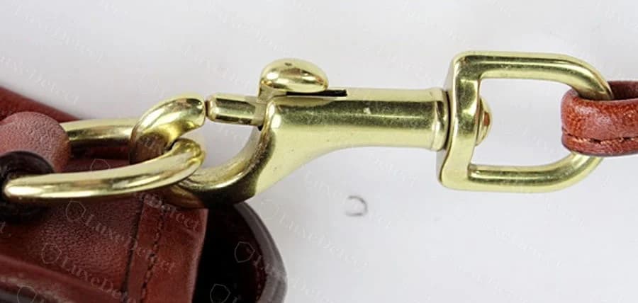 Authentic Legacy swivel hook hardware: sharp casting edges, bright and even brass finish.