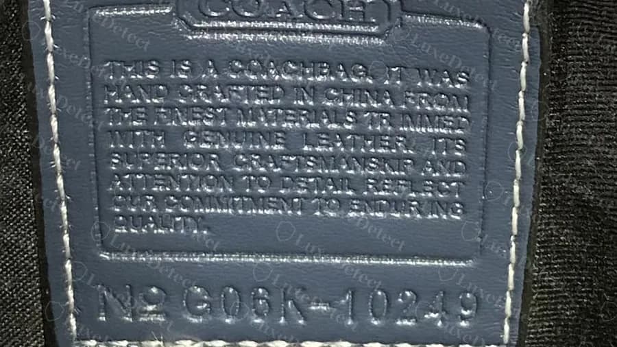 Creed patch inside a confirmed counterfeit quilted denim Tabby: the pre-2014 "hand crafted in China" wording in a bag design that dates from 2019 on.