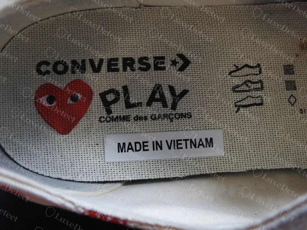 Genuine CDG PLAY x Converse insole printed with the CONVERSE logo, a red heart with eyes and PLAY COMME des GARÇONS, with a white MADE IN VIETNAM sticker below