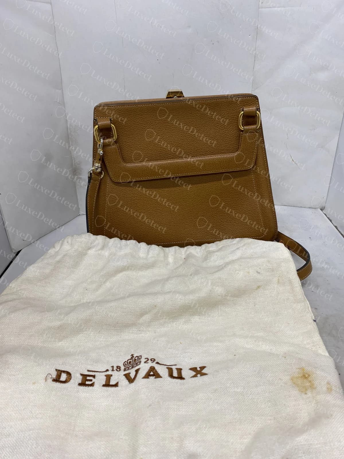 Counterfeit Delvaux Brillant interior stamp reading Handmade in Belgium, on a different fake bag with the same third-line pattern