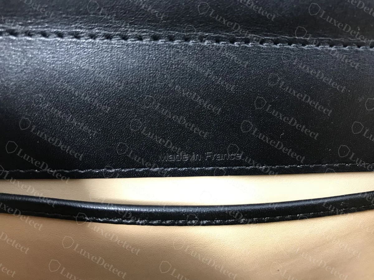 Genuine Delvaux Brillant interior stamp reading DELVAUX BRUXELLES over Made in France, in the fine house serif with no third line