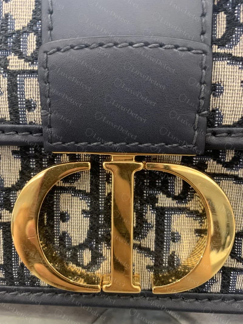 A genuine 30 Montaigne flap bag in smooth black calfskin, showing the overall proportions, adjustable strap, and gold CD clasp