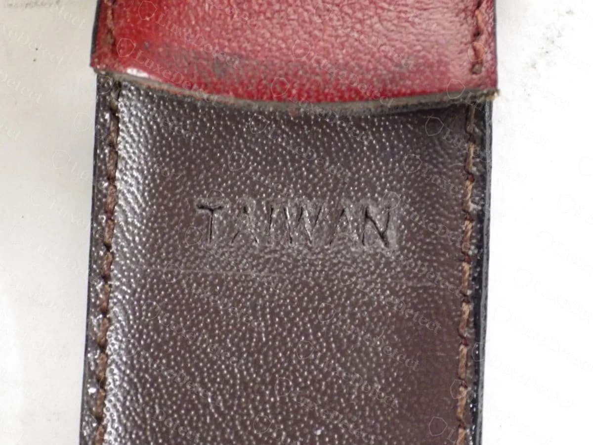 Genuine vintage licensed Christian Dior belt, the keeper end heat-stamped "TAIWAN" into the brown leather lining