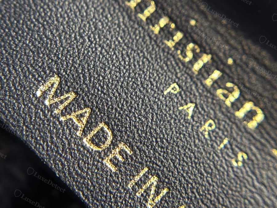 A production tag from a counterfeit in our archive, in the same "50-MA-####" format.