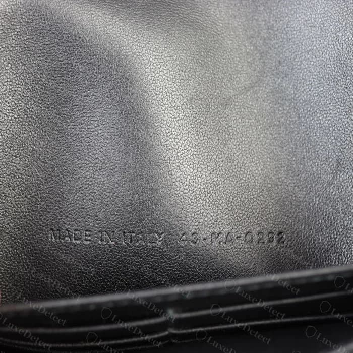 Genuine Caro interior reference code, embossed into the leather lining rather than foil-stamped