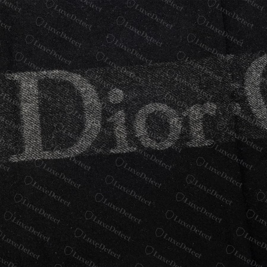 Authentic fringe on a genuine Dior wool jacquard scarf: full-length, evenly twisted cords with no fraying, uniform across the width