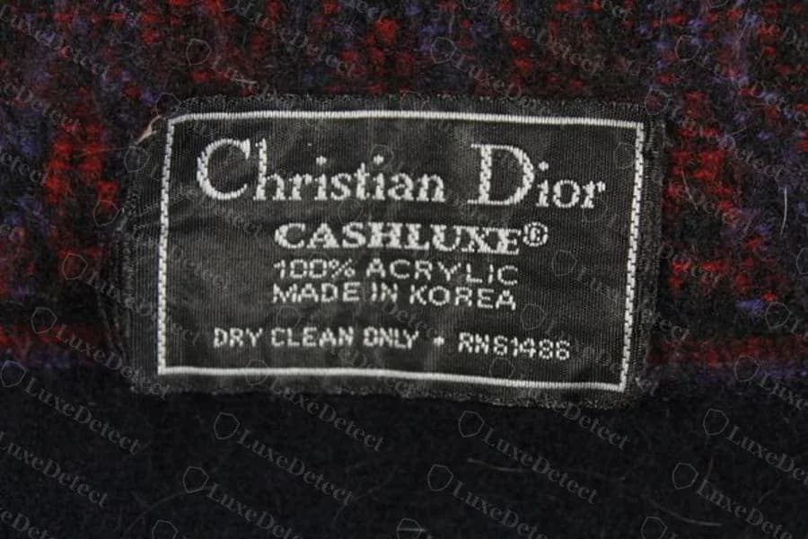 Authentic "Christian Dior" woven label reading CASHLUXE, 100% Acrylic, Made in Korea, on a genuine wool-acrylic scarf