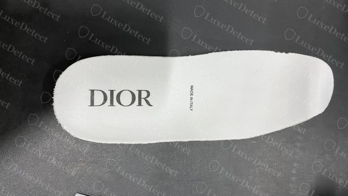 Genuine Dior B23 insole, DIOR in thin capital serif letters with a tiny MADE IN ITALY printed beside it (rotated to read left to right)