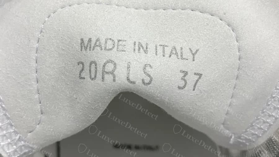 Genuine Dior B23 tongue stamp, MADE IN ITALY above a date and size code, stamped into the white suede lining under the tongue