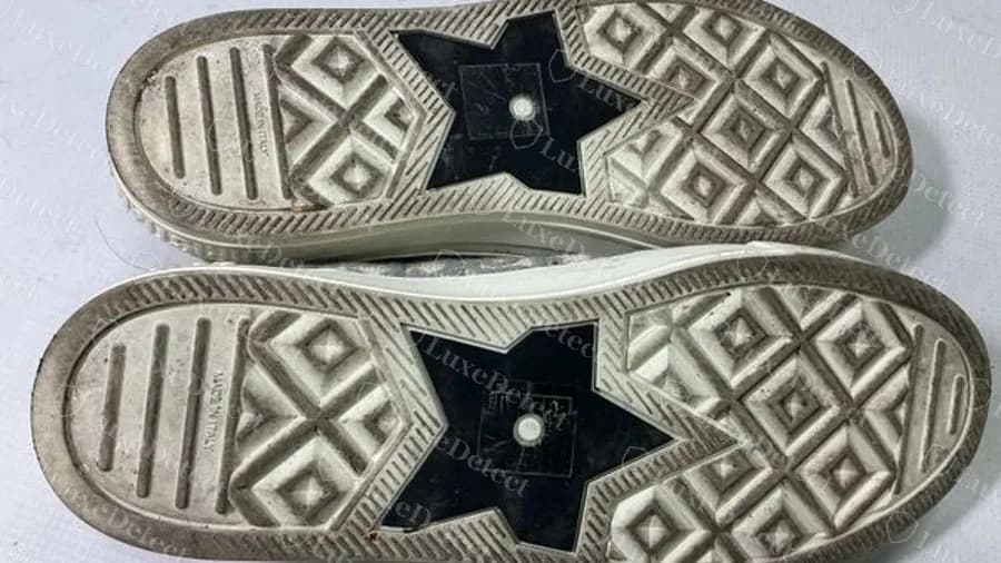 Genuine Dior Walk'n'Dior sneaker outsole, a black star plate in the middle of the sole with a diamond tread and MADE IN ITALY moulded at the heel