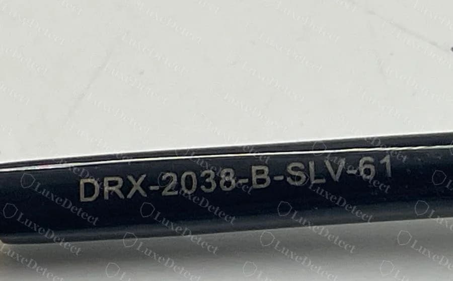 Haste do DITA Matador original com a linha de código DRX-2038-B-SLV-61 gravada no acetato