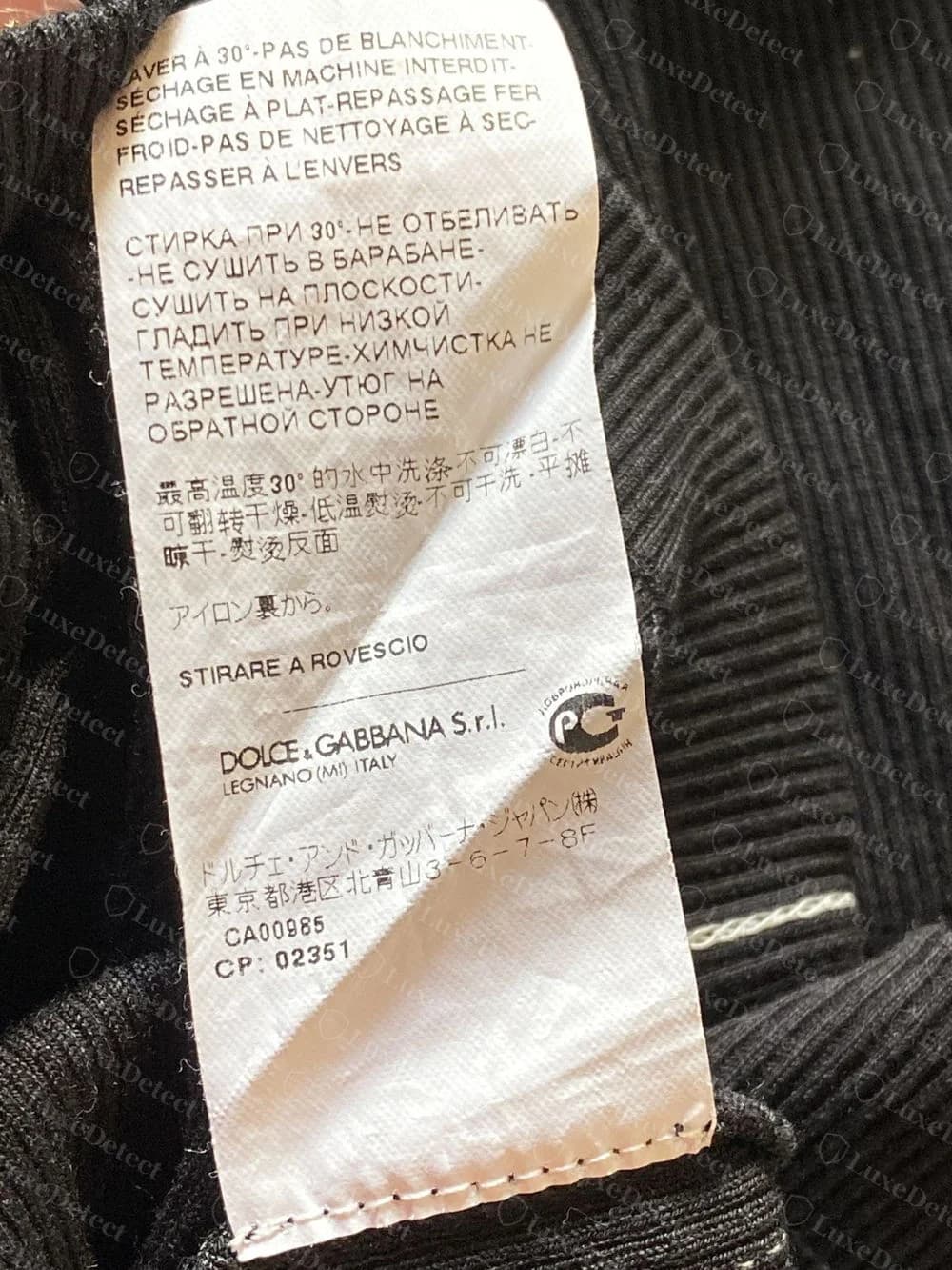 Genuine Dolce&Gabbana care label, second panel: care text in French, Russian, Chinese and Japanese, DOLCE&GABBANA S.r.l. LEGNANO (MI) ITALY, the Russian mark, CA00985 and CP: 02351