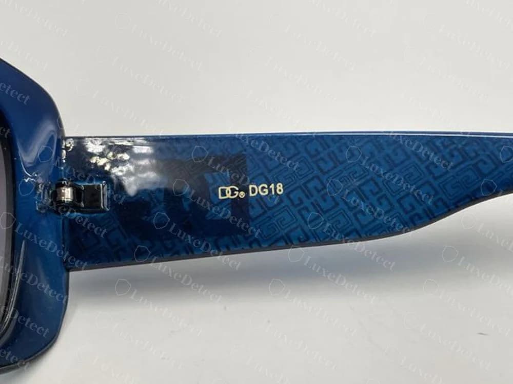Imitación DG falsa con un estampado azul: logo DG dorado y el número DG18 en la varilla, sin nombre de marca