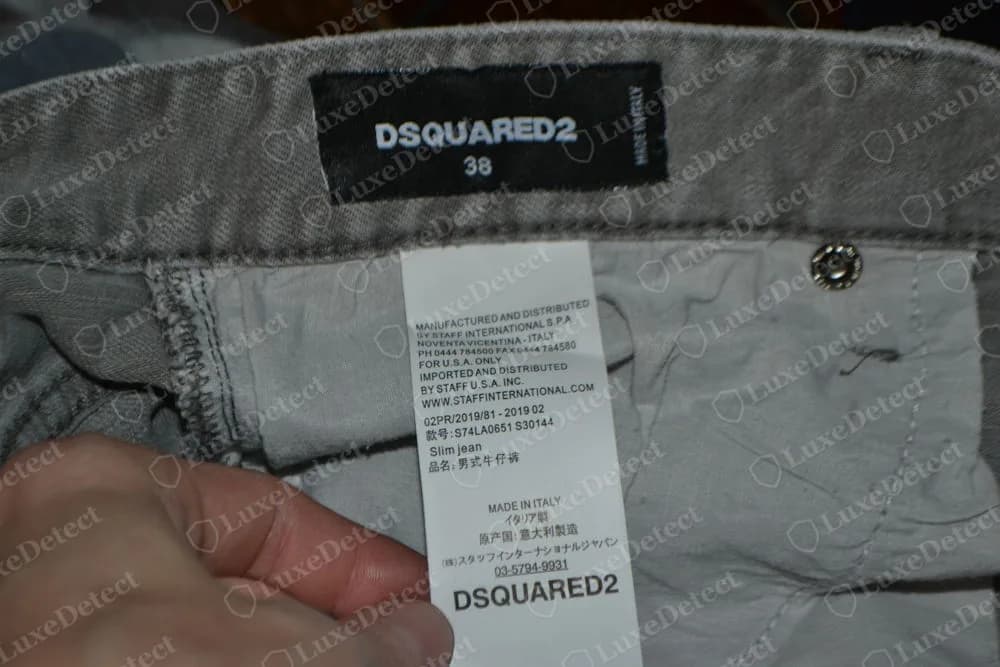 Genuine Dsquared2 slim jeans waistband: black woven DSQUARED2 label with size 38 and a small MADE IN ITALY line along its edge, above a white wash label that names Staff International and ends with MADE IN ITALY and DSQUARED2