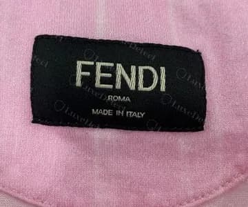 Genuine Fendi T-shirt neck label: FENDI, ROMA and MADE IN ITALY on a black woven label, nothing hanging beneath it