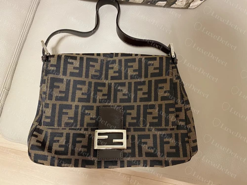 Genuine Fendi Zucca canvas Mamma flap bag: the double-F pattern running cleanly across flap and body, a leather tab and a FENDI-engraved strap end