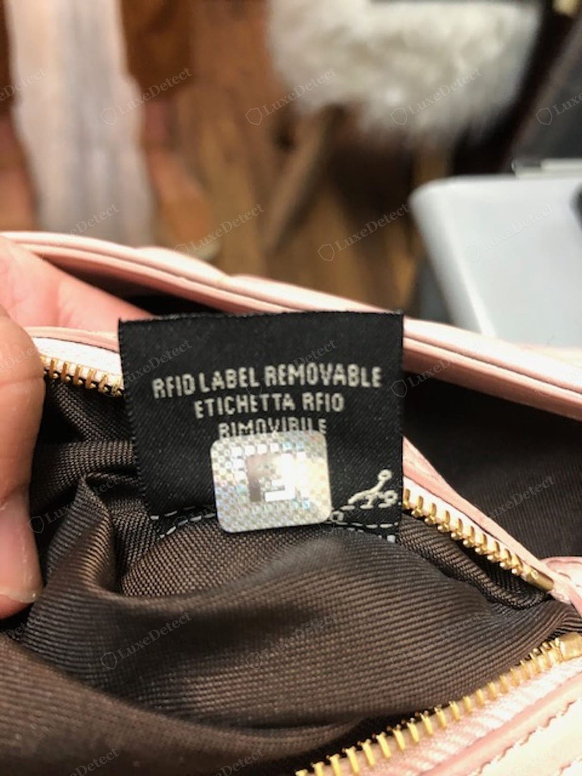 Counterfeit Fendi Baguette authenticity/RFID card — a blurry print, a wrong layout, or a code that does not match the bag; genuine newer bags carry an NFC chip, and the card alone proves nothing