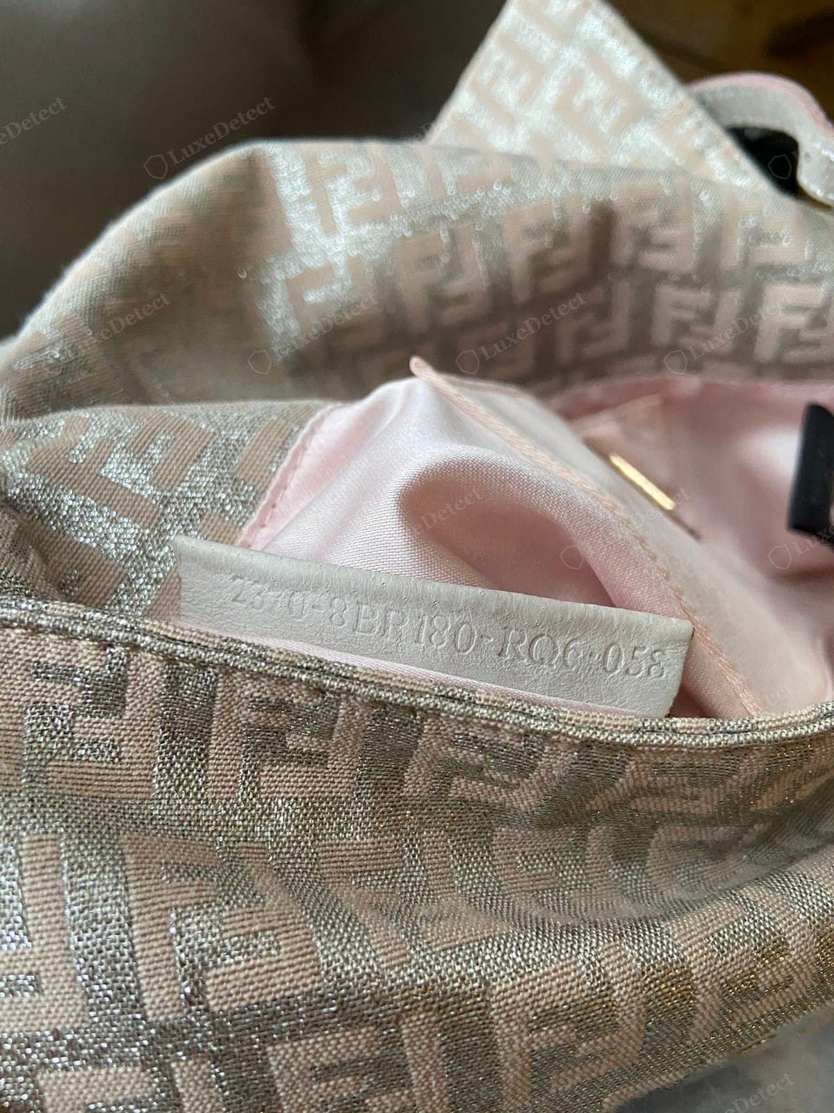 Genuine Fendi Baguette serial embossing — the serial and "MADE IN ITALY" cleanly pressed into the leather tab in the Fendi typeface, even depth