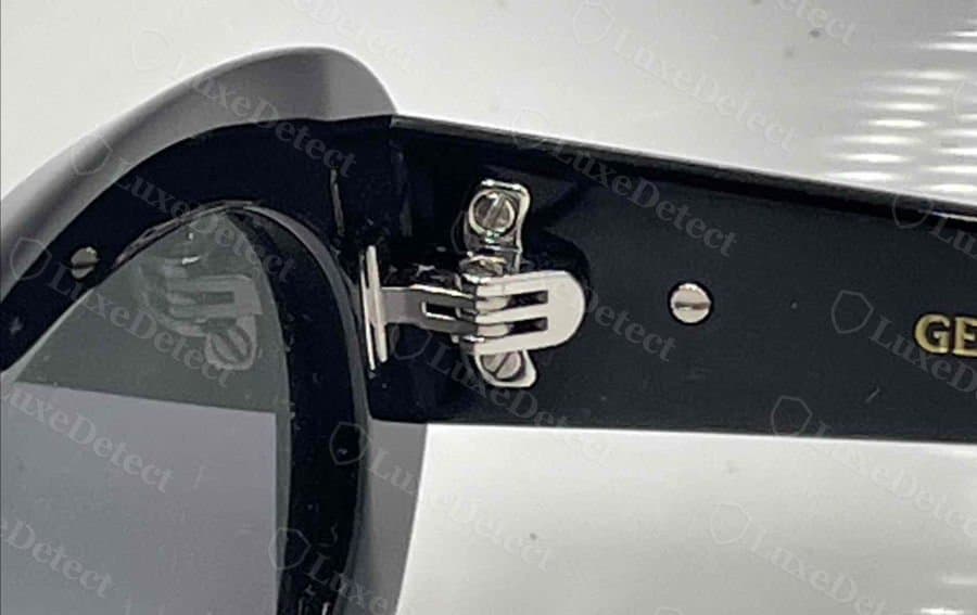 Genuine Gentle Monster hinge: a multi-part spring hinge with ridged, interlocking barrel segments and a clean polish.