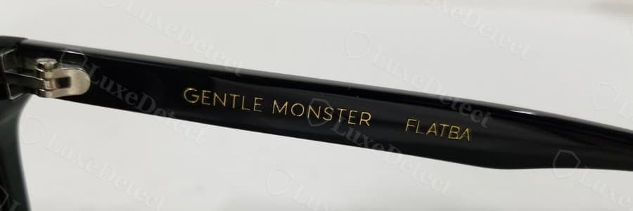 Genuine Gentle Monster temple text: tight, even kerning on the "GENTLE MONSTER FLATBA" print.
