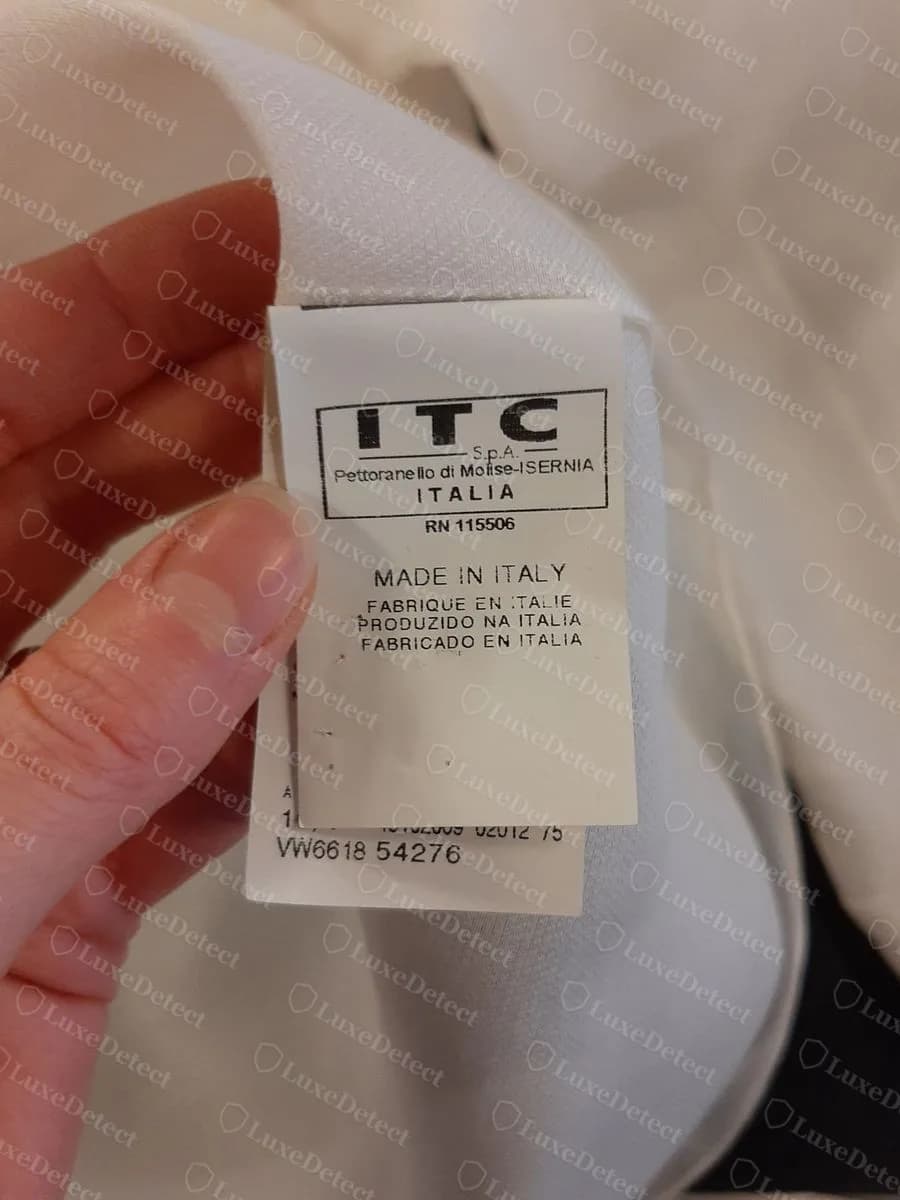 Genuine Ferré blouse care label: white tag boxed ITC S.p.A. Pettoranello di Molise-ISERNIA ITALIA, RN 115506, MADE IN ITALY in four languages, and a style code beginning VW6618