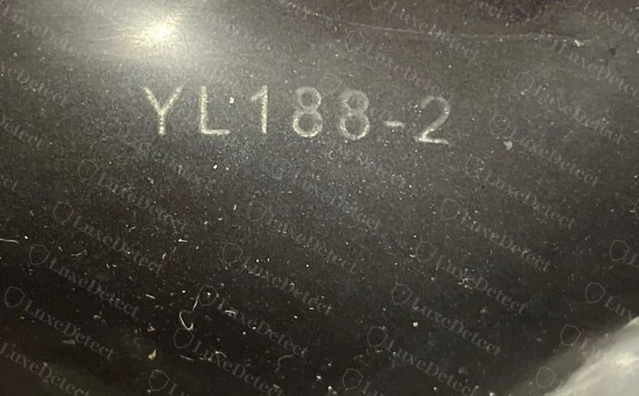 Counterfeit Givenchy slide with the same YL188-2 code moulded inside the strap