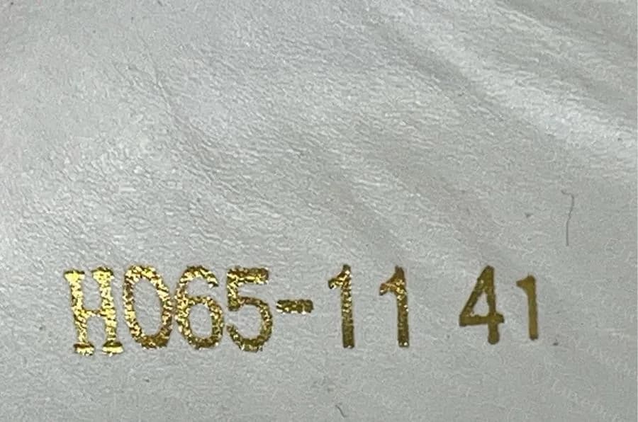 Counterfeit Givenchy low-top with H065-11 and the size 41 stamped in gold on pale lining