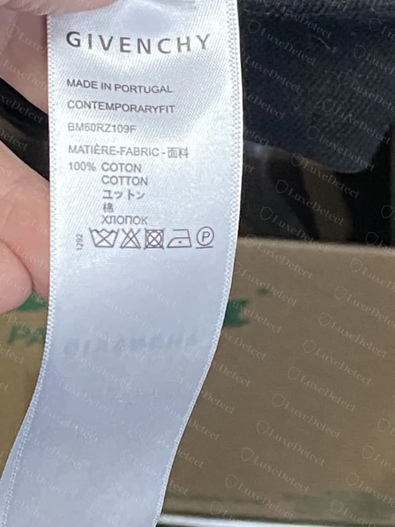 Counterfeit Givenchy hoodie label reading CONTEMPORARYFIT and style code BM60RZ109F, with the identical wash symbols to the label below.