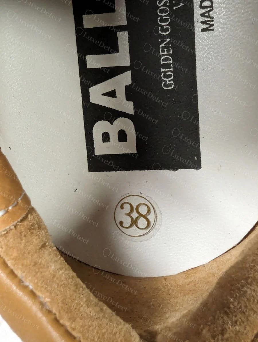 Semelle intérieure Golden Goose contrefaite : un numéro de pointure « 38 » cerclé imprimé sur le talon de la semelle intérieure, sous le panneau du modèle