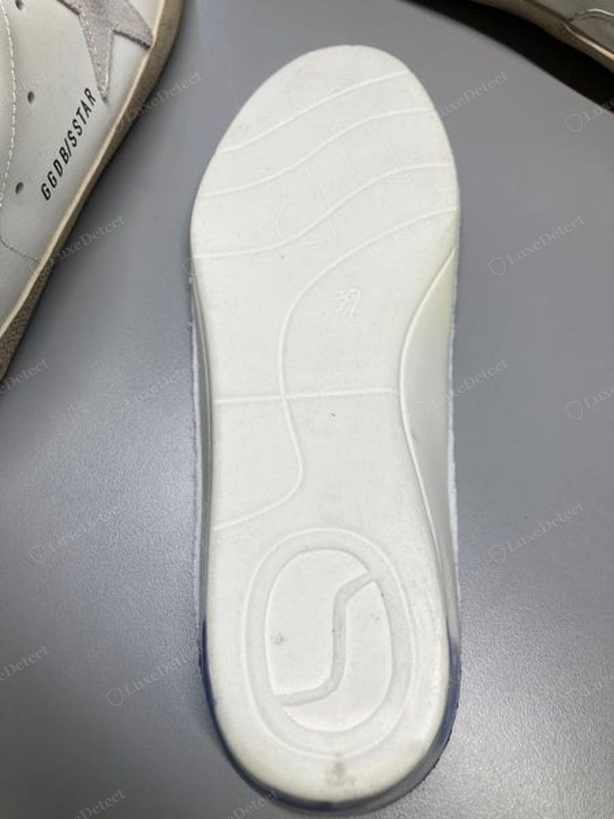 Counterfeit Golden Goose insole reverse — a blank, wrong, or crudely printed back