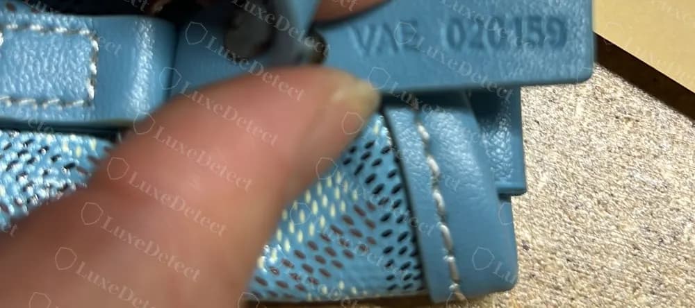 Counterfeit blue Goyard Anjou PM heat-stamped with the identical code VAE 020159